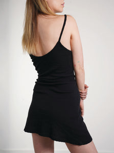 A black soft and stretchy mini tank dress made with 100% organic cotton fabric featuring a pointelle rib stitch detail